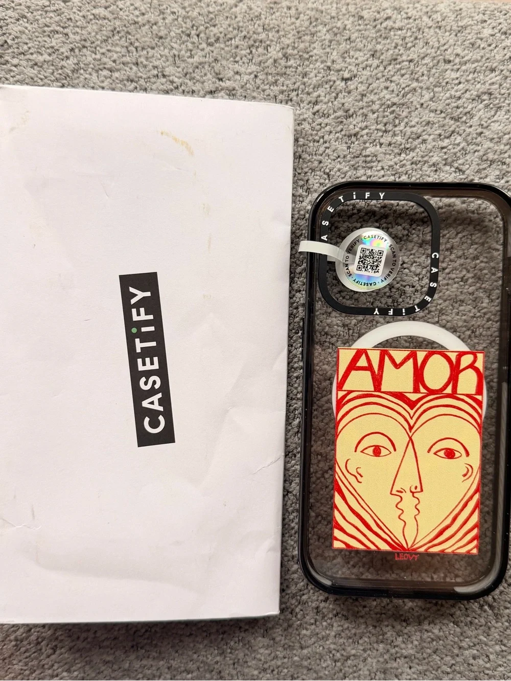 Casetify Clear Case with Black Bumper and Red & Cream AMOR Card